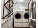 Practical laundry room featuring stacked washer and dryer with nearby rack at 7082 Muskrat Dr, Nineveh, IN 46164
