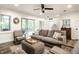 Inviting living room featuring sliding doors to screened porch, comfortable seating, and stylish decor at 7082 Muskrat Dr, Nineveh, IN 46164
