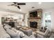 Open concept layout featuring a stone fireplace, a comfortable sofa, and a modern kitchen at 7082 Muskrat Dr, Nineveh, IN 46164