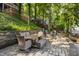 Lake property featuring a stone patio with a dining area and lake access at 7082 Muskrat Dr, Nineveh, IN 46164