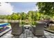 Patio area featuring outdoor seating overlooking a serene lake at 7082 Muskrat Dr, Nineveh, IN 46164