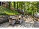 Lake property featuring a stone patio with a dining area and lake access at 7082 Muskrat Dr, Nineveh, IN 46164