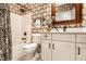 Stylish bathroom with patterned wallpaper, classic vanity, and shower/tub combo at 8044 Clymer Ln, Indianapolis, IN 46250