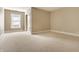 Neutral bedroom with plush carpeting, natural light, and convenient closet access at 8044 Clymer Ln, Indianapolis, IN 46250