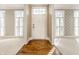 Bright foyer featuring wood and carpet flooring with sidelight windows and a decorated transom window at 8044 Clymer Ln, Indianapolis, IN 46250