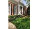 Traditional brick home with black shutters, mature landscaping and a meticulously maintained lawn at 8044 Clymer Ln, Indianapolis, IN 46250