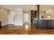 Open kitchen showcasing a center island, hardwood floors, stainless steel appliances, and ample cabinet space at 8044 Clymer Ln, Indianapolis, IN 46250
