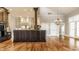 Charming kitchen with center island, hardwood flooring, stainless steel appliances, and ample cabinet storage at 8044 Clymer Ln, Indianapolis, IN 46250