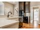 Modern kitchen with dark wood cabinets, stainless steel appliances, and a white countertop at 8044 Clymer Ln, Indianapolis, IN 46250