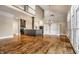Spacious living area with hardwood floors, fireplace, built-in shelving, and an open floor plan at 8044 Clymer Ln, Indianapolis, IN 46250