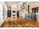 Bright living room with fireplace, built-in shelving, hardwood floors, and a vaulted ceiling at 8044 Clymer Ln, Indianapolis, IN 46250