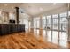 Open-concept living space with hardwood floors, large windows, and a kitchen island with pendant lighting at 8044 Clymer Ln, Indianapolis, IN 46250