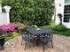 Outdoor patio features a decorative table and chairs perfect for backyard entertaining at 8044 Clymer Ln, Indianapolis, IN 46250