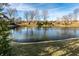 Picturesque pond view that is surrounded by mature trees at 8044 Clymer Ln, Indianapolis, IN 46250