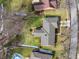 An aerial view shows the home in a residential neighborhood with well-maintained lawns and mature trees at 8316 Hill Gail Dr, Indianapolis, IN 46217
