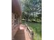 This backyard shows a well-kept yard, deck, and playground in the distance, making it great for entertaining and relaxation at 8316 Hill Gail Dr, Indianapolis, IN 46217
