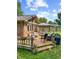 A backyard deck featuring an umbrella and chairs set up for relaxing and grilling at 8316 Hill Gail Dr, Indianapolis, IN 46217