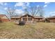 Expansive backyard featuring a wooden deck, providing a great space for outdoor activities and gatherings at 8316 Hill Gail Dr, Indianapolis, IN 46217