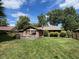 Spacious backyard featuring a well-maintained lawn and a wooden deck, perfect for outdoor enjoyment at 8316 Hill Gail Dr, Indianapolis, IN 46217