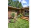 Charming backyard space featuring a well-maintained lawn, patio area and access to the home's interior at 8316 Hill Gail Dr, Indianapolis, IN 46217