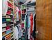 Walk-in closet with extensive shelving and rods filled with clothing, shoes and purses at 8316 Hill Gail Dr, Indianapolis, IN 46217