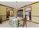 Charming dining room with chandelier, china cabinet and decor for an elegant dining experience at 8316 Hill Gail Dr, Indianapolis, IN 46217