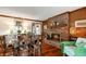 Inviting dining area features hardwood floors, fireplace, and a seamless blend of modern and vintage decor at 8316 Hill Gail Dr, Indianapolis, IN 46217