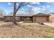 Brick home with a well-manicured lawn, showcasing classic curb appeal and a welcoming entrance at 8316 Hill Gail Dr, Indianapolis, IN 46217