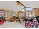Spacious living room with vaulted ceiling, natural lighting, comfortable seating, and a ceiling fan at 8316 Hill Gail Dr, Indianapolis, IN 46217