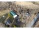 Aerial view of multiple buildings on a property, including barns and outbuildings with green roofs at 8350 E Cr 200 S, Zionsville, IN 46077