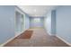 Finished basement with sliding glass door and carpeted floors at 8350 E Cr 200 S, Zionsville, IN 46077