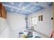 Unfinished basement featuring primed walls, partial ceiling work, and an old fan at 8350 E Cr 200 S, Zionsville, IN 46077