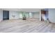 Spacious basement with new gray wood floors, open layout, and unfinished sections ready for customization at 8350 E Cr 200 S, Zionsville, IN 46077