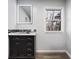 Bathroom features include a mirror, dark cabinets, and stone countertops at 8350 E Cr 200 S, Zionsville, IN 46077