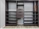 Walk-in closet with dark wood shelving and drawers at 8350 E Cr 200 S, Zionsville, IN 46077