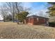 Brick home featuring a classic design, surrounded by mature trees on a spacious lawn at 8350 E Cr 200 S, Zionsville, IN 46077