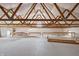 Open loft with exposed beams providing ample storage or workspace, ready for customization at 8350 E Cr 200 S, Zionsville, IN 46077