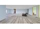 Spacious room featuring light gray flooring and walls, ideal for a modern living space at 8350 E Cr 200 S, Zionsville, IN 46077