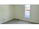 Cozy bedroom with carpet, neutral walls, and a window with an outside view at 104 Walnut Ct, Noblesville, IN 46062