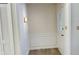 Well-lit entryway featuring trim, wood-look flooring, a closet, and a glass door at 104 Walnut Ct, Noblesville, IN 46062