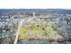 Breathtaking aerial view of a town featuring houses, lush trees, and a water tower at 114 E Mill St, Brooklyn, IN 46111