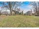 Backyard featuring a stone house and a storage shed at 114 E Mill St, Brooklyn, IN 46111