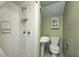 Bathroom featuring a walk-in shower, toilet, sink and built in cabinet at 114 E Mill St, Brooklyn, IN 46111
