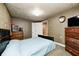 Bedroom with patterned wallpaper, ceiling light and side dresser at 114 E Mill St, Brooklyn, IN 46111