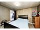 Bedroom with patterned wallpaper and a ceiling light at 114 E Mill St, Brooklyn, IN 46111