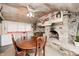 The eat-in dining area boasts a stone fireplace and is filled with natural light at 114 E Mill St, Brooklyn, IN 46111