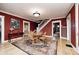 Inviting dining room featuring hardwood floors, a round table, and a staircase at 114 E Mill St, Brooklyn, IN 46111