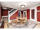 Inviting dining room featuring hardwood floors, a round table, and a staircase at 114 E Mill St, Brooklyn, IN 46111