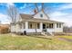 Charming two-story home with a welcoming front porch and well-maintained lawn at 114 E Mill St, Brooklyn, IN 46111