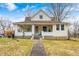 Charming two-story home with a welcoming front porch and well-maintained lawn at 114 E Mill St, Brooklyn, IN 46111